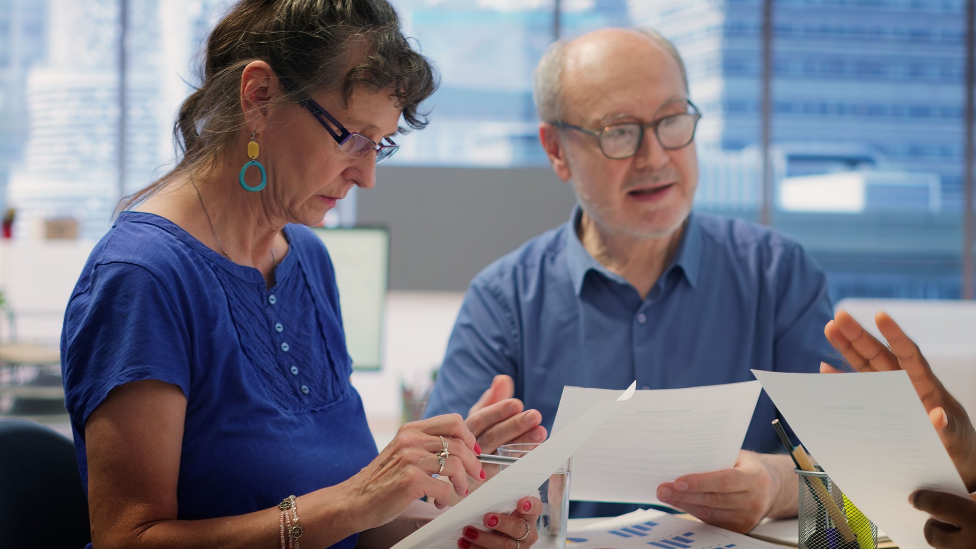 Mature couple meeting with a financial expert to develop a retirement plan